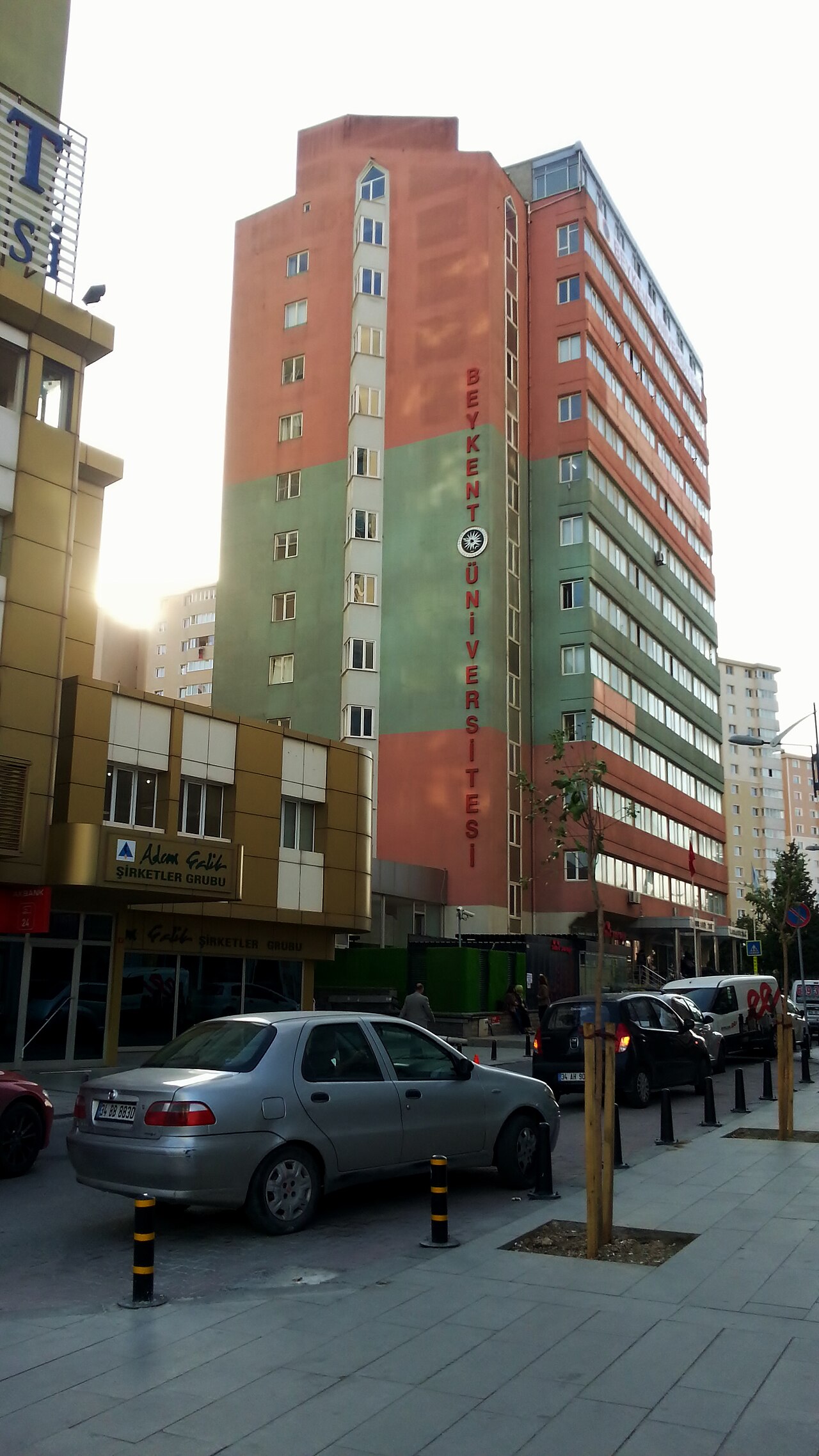 A campus building of Istanbul Beykent University, with the vertical "BEYKENT ÜNİVERSİTESİ" sign and university emblem on its facade.